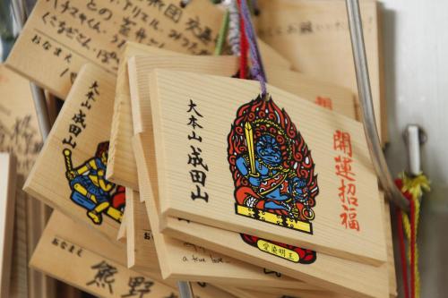 a pile of chopsticks on a pile of paper at Wakamatsu Honten in Narita