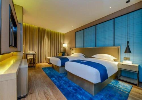 En eller flere senger på et rom på Echarm Hotel Guizhou Zunyi Renhuai
