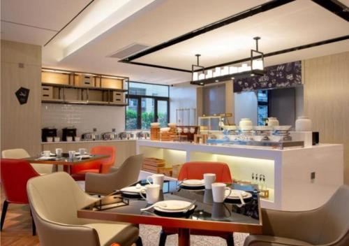 מסעדה או מקום אחר לאכול בו ב-Echarm Hotel Changsha Huangxing Avenue Airport