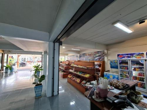 a grocery store with a counter in the middle of a room at Phu Nga Hotel in Natai Beach