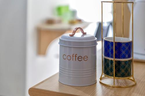 a coffee can sitting on a table next to a cup at Sabor de Mar in Alghero