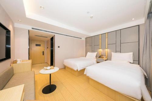Krevet ili kreveti u jedinici u okviru objekta Ji Hotel Beijing Guomao East