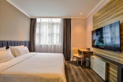 Cama o camas de una habitación en Hanting Hotel Ningbo Jishigang Outlets