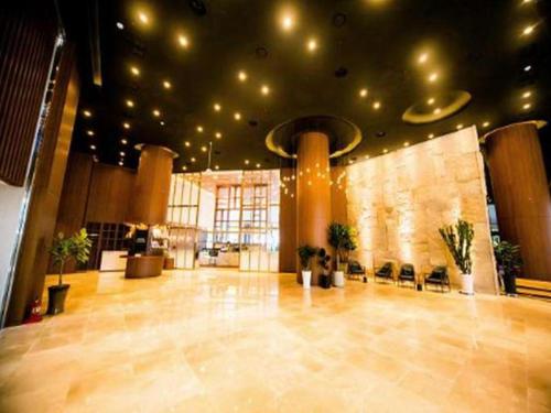 a large lobby with a large room with a large floor at Grand Hillstone in Jeonju