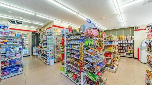 a store aisle of a store with a lot of products at Gangneung Four Season Hotel and Pension in Gangneung