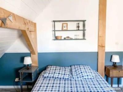 Ένα ή περισσότερα κρεβάτια σε δωμάτιο στο Maison bois plages à pied