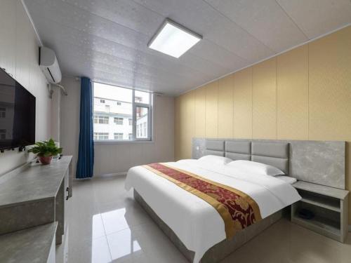 Giường trong phòng chung tại GreenTree Apartment Jinan Jiyan Road Shandong Cancer Hospital