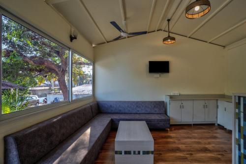 a living room with a couch and a table at Amore Serenity Resort in Arambol