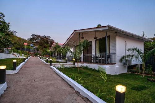 a house with a pathway in front of it at Amore Serenity Resort in Arambol