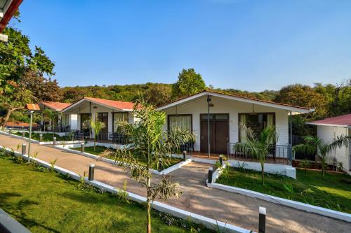 a row of bungalows in a resort at Amore Serenity Resort in Arambol