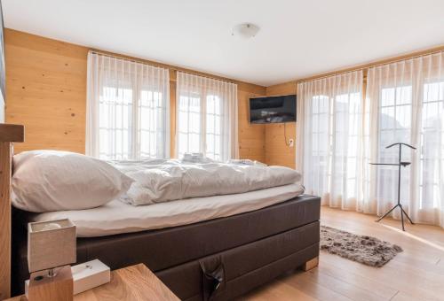 Apartment Bränderli 4,5 - GRIWA RENT AGにあるベッド