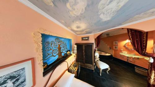 a room with a painting on the ceiling at Hotel Utopía in Benalup Casas Viejas