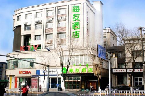 a building with a sign on the side of it at Hi Inn Hohhot Xilin Nan Road in Hohhot