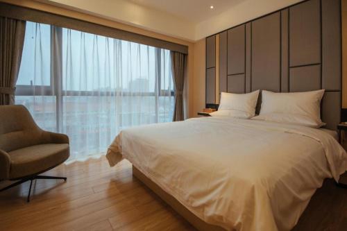 Cama ou camas em um quarto em Starway Hotel Tangshan Zunhua Bus Station