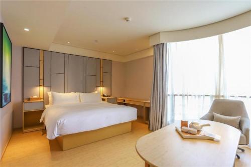Cama o camas de una habitación en Ji Hotel Wuhan Hankou Railway Station Tangjiadun