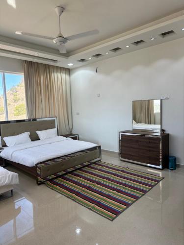 Cama o camas de una habitación en استراحة العلى جبل شمس jabal shams
