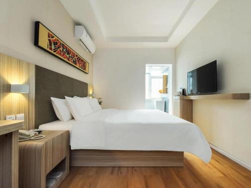 Katil atau katil-katil dalam bilik di Hanting Hotel Luzhou Bell and Drum Tower