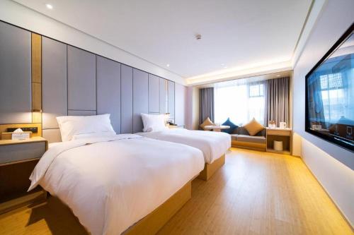 Vuode tai vuoteita majoituspaikassa Ji Hotel Ningbo Xiangshan