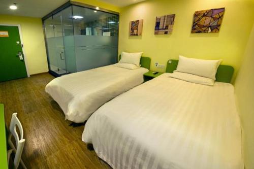 Krevet ili kreveti u jedinici u objektu Hi Inn High-tech Wanda Plaza