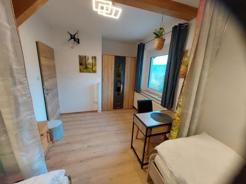a living room with a couch and a table at HomeW4 Apartment Waldviertel in Hoheneich