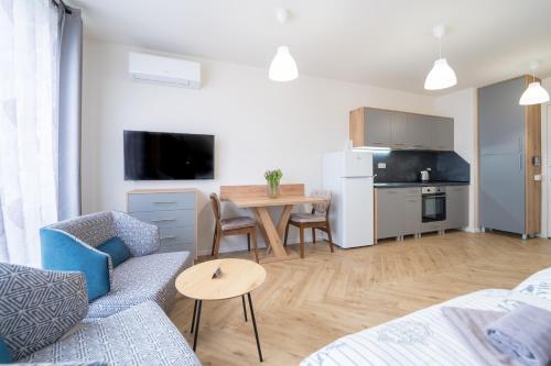 a living room with a couch and a table at WOW studios for rent - bul Montevideo 25A - B in Sofia