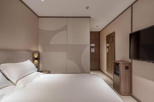Katil atau katil-katil dalam bilik di Hanting Hotel Xiamen Airport Chenggong Avenue