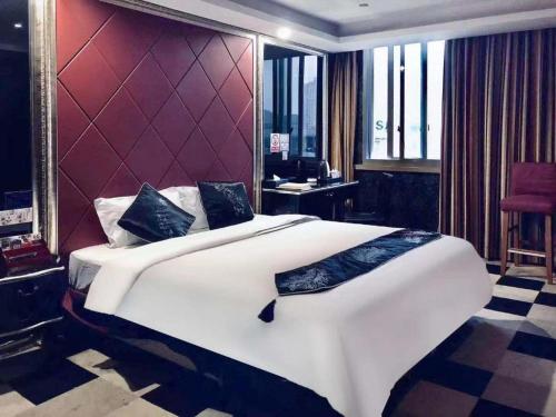 Cama ou camas em um quarto em Elan Boutique Hotel Wenzhou Yueqing Hotel