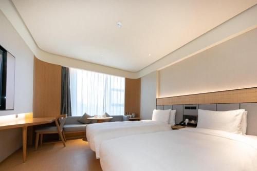 Ji Hotel Guiyang Guanshan Lake High-Tech Zone房間的床