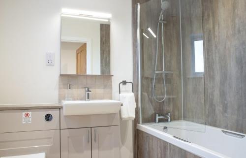 a bathroom with a sink and a shower at Taigh Cill Chriosd in Kilbride