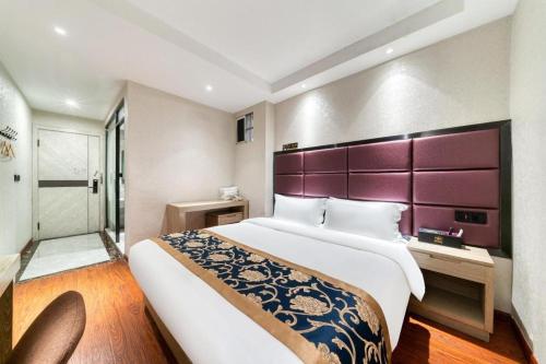 Säng eller sängar i ett rum på Elan Boutique Hotel Wenzhou Longwan Haicheng