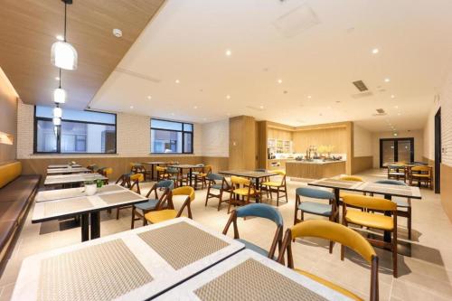 En restaurant eller et andet spisested på Hanting Premium Hotel Tai'An Railway Station High-Speed Rail North Street