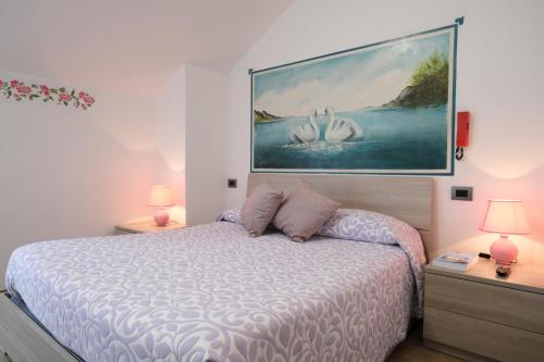 En eller flere senge i et værelse på Albergo alla spiaggia