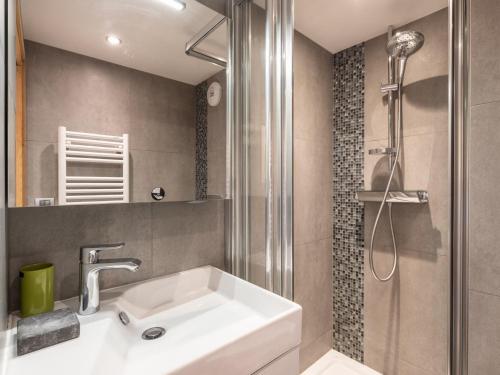 a bathroom with a sink and a shower at Appartement La Clusaz, 6 pièces, 7 personnes - FR-1-304-175 in La Clusaz