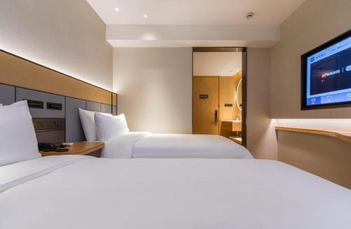 Легло или легла в стая в Hanting Premium Hotel Shanghai Longwu Road Hotel