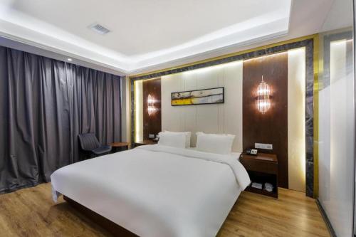 Starway Hotel Fuyang Funan Economic Development Zoneにあるベッド