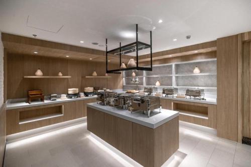 A cozinha ou cozinha compacta de Hanting Premium Hotel Hailar Central Road