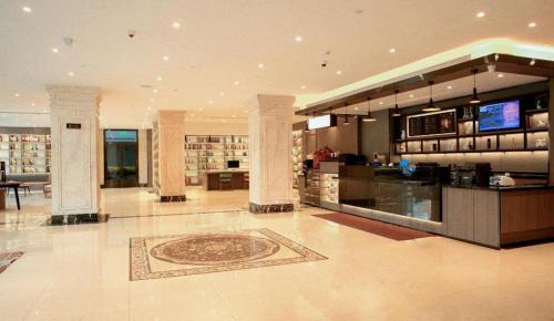 Majoituspaikan Hanting Hotel Changchun Yiqi Chuangye Street aula tai vastaanotto