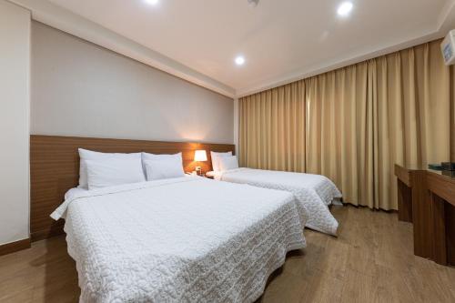 Postel nebo postele na pokoji v ubytování Juwang Mt Oncheon Tourist Hotel