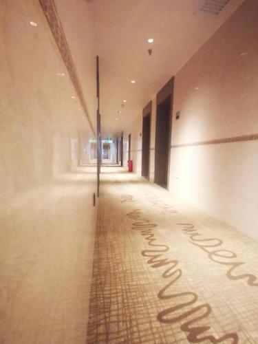 a hallway with writing on the floor of a building at Hanting Hotel Zhangjiajie Tianmen Mountain Scenic Spot in Zhangjiajie