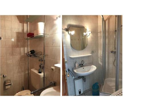 La salle de bains est pourvue d'une douche, d'un lavabo et de toilettes. dans l'établissement Fewo mit eigener Terrasse und Ausblick, à Mechernich