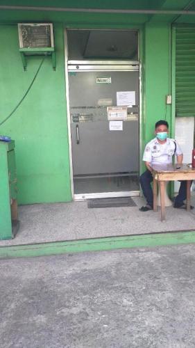 a man sitting at a table wearing a mask at Asia Novo Boutique Hotel-Cabuyao in Bigaa