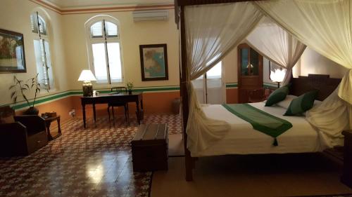 Ένα ή περισσότερα κρεβάτια σε δωμάτιο στο La Villa