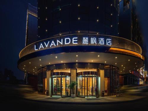 a large building with a sign on the front of it at Lavande Hotel Changsha South High-speed Railway Station Xiyingmen in Changsha
