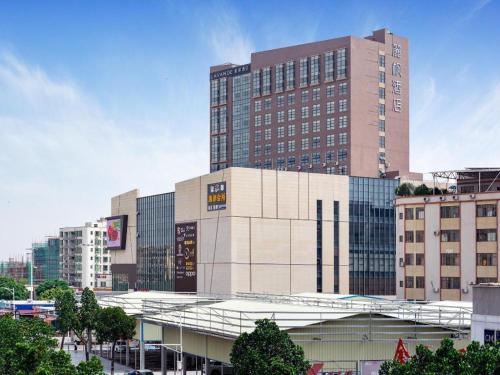 a large tall building in a city with buildings at Lavande Hotel Zhongshan Xiaolan Taifeng in Jilong