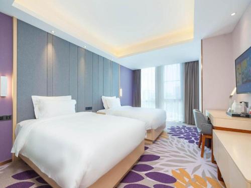 Katil atau katil-katil dalam bilik di Lavande Hotel Beijing Huairou Yanqi Science City