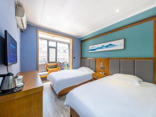 Llit o llits en una habitació de FERONIA Hotel Gansu Lanzhou Chengguan District Gannan Road