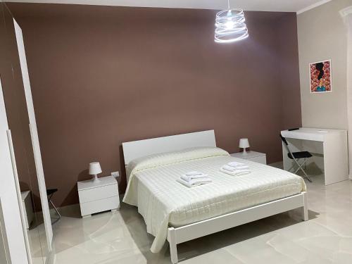 Ένα ή περισσότερα κρεβάτια σε δωμάτιο στο Marconi Rooms and Apartaments