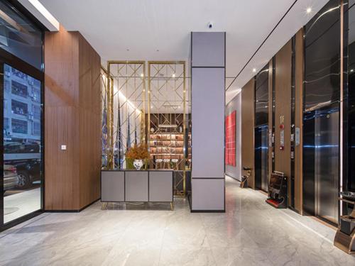 a lobby of a building with a wine cellar at Borrman Hotel Wuzhou Teng County in Tengcheng