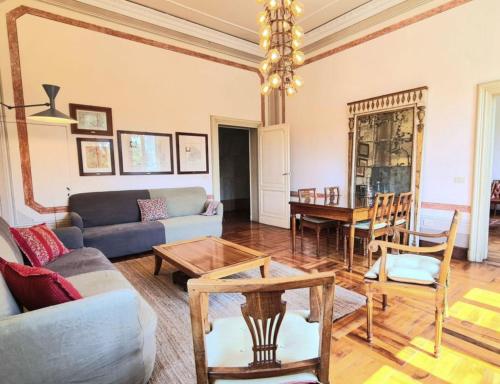 a living room with a couch and a table at Castello di Lispida in Monselice