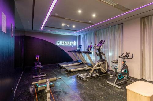 a gym with several exercise bikes in a room at Atour Hotel Suzhou New District Shishan Huaihai Street in Suzhou